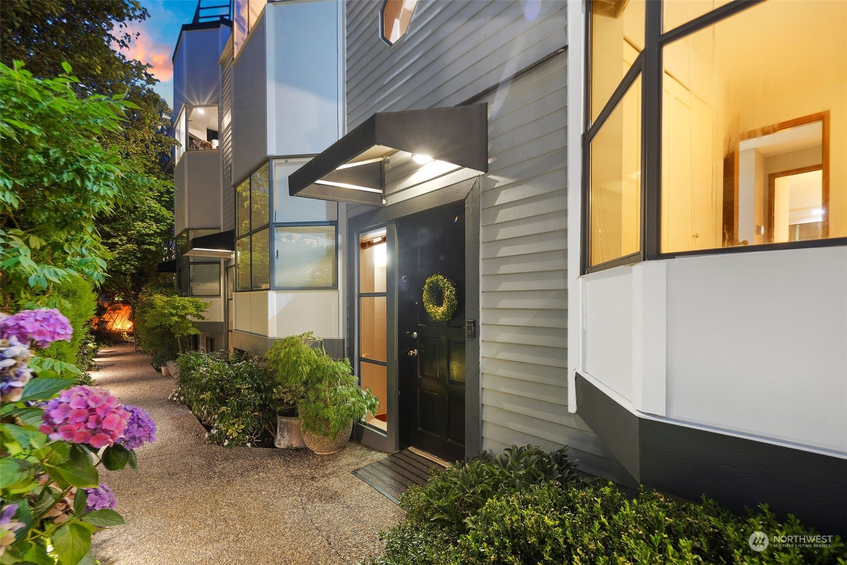 416 Daley Street, Unit C Edmonds, WA 98020 - Photo 36 of 38 a front view of a house with lots of flowers