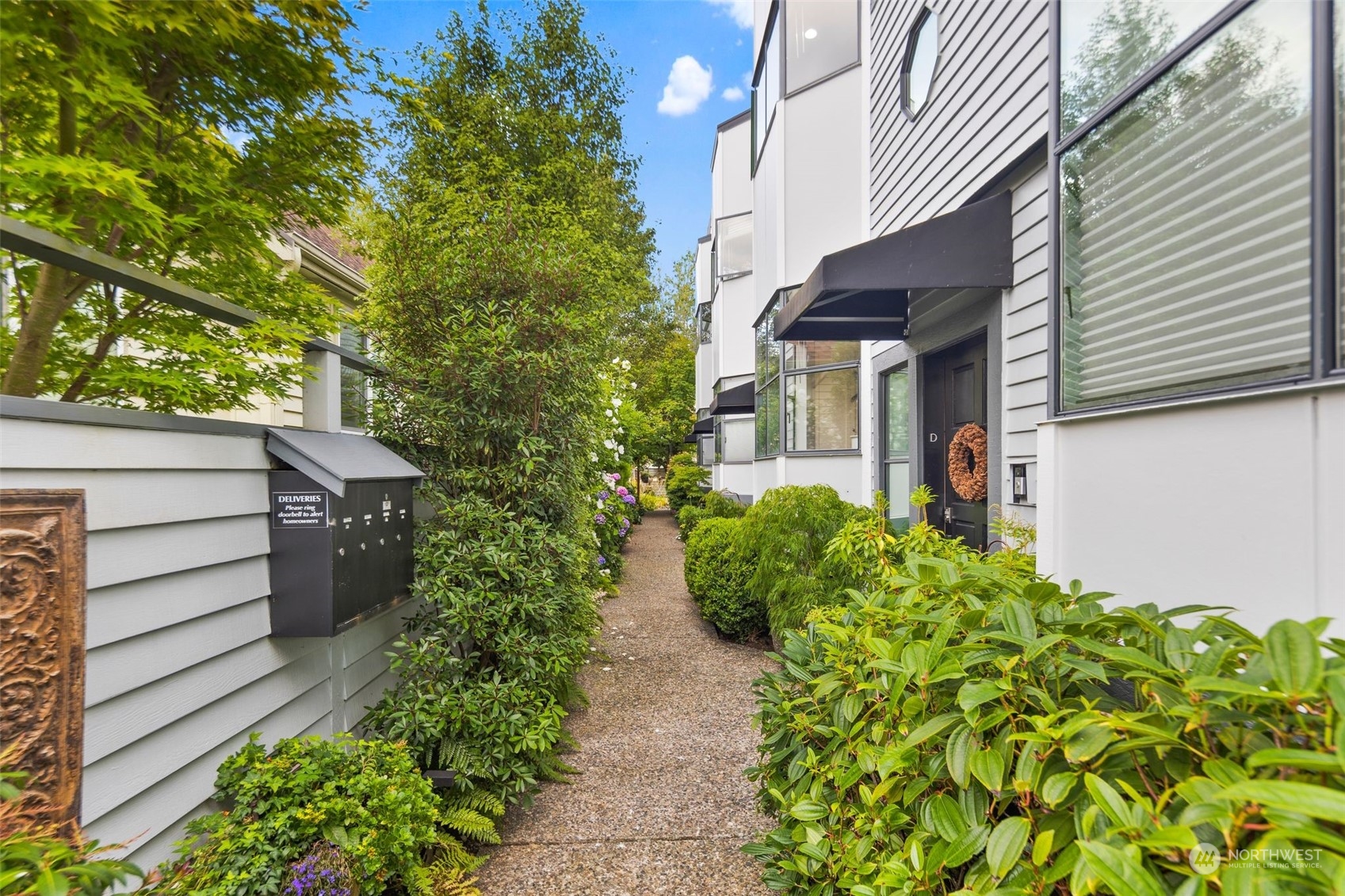 416 Daley Street, Unit C Edmonds, WA 98020 - Photo 4 of 38 a view of a house with a flower garden