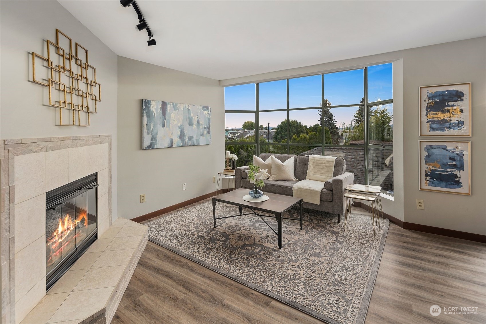 416 Daley Street, Unit C Edmonds, WA 98020 - Photo 6 of 38 a living room with furniture a large window and a fireplace
