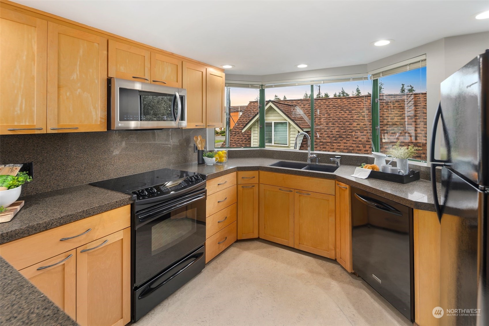 416 Daley Street, Unit C Edmonds, WA 98020 - Photo 9 of 38 a kitchen with a sink stove and microwave