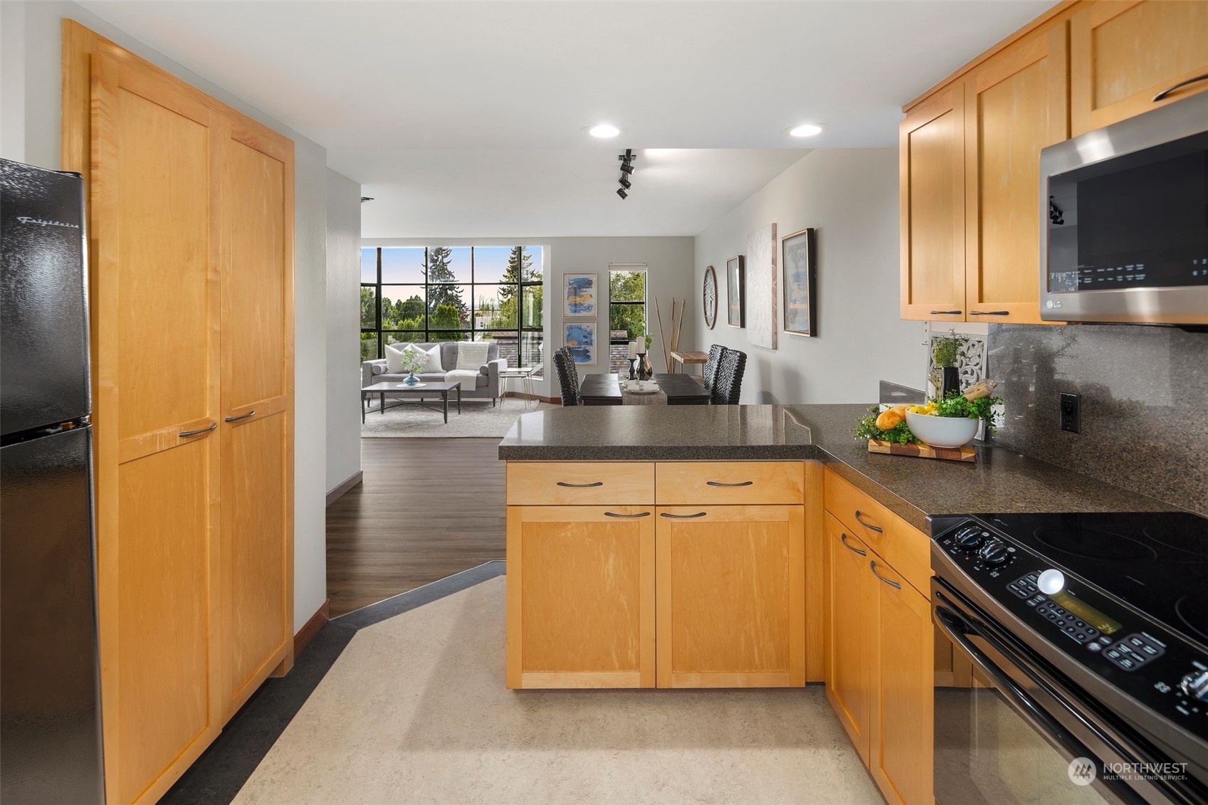 416 Daley Street, Unit C Edmonds, WA 98020 - Photo 10 of 38 a kitchen with stainless steel appliances granite countertop a sink stove and refrigerator