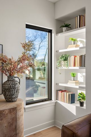 a kitchen with stainless steel appliances granite countertop a refrigerator a sink a stove and a wooden floors