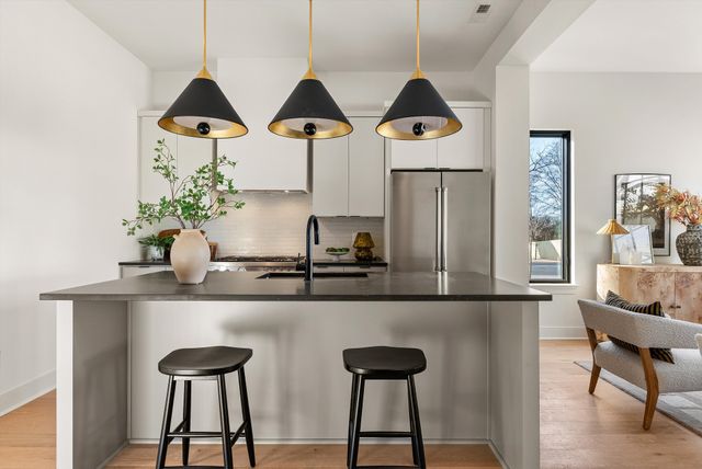 a kitchen with a stove and a refrigerator