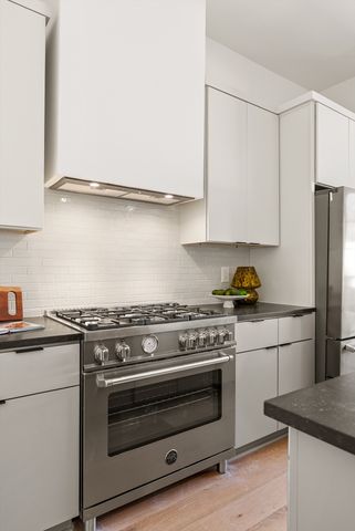 a kitchen with a sink and a refrigerator