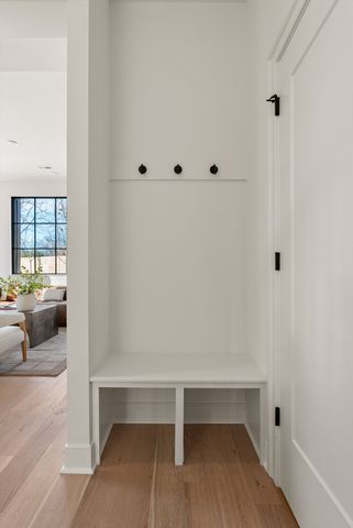 a view of a workspace with furniture and a potted plant