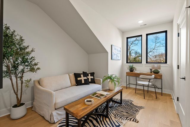 a black and white photo of a bench