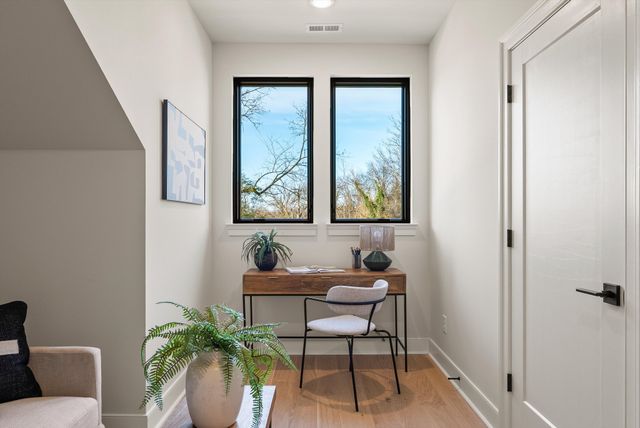 a view of a building with a snow on the road