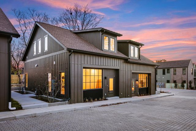 a view of a cafe with a lot of people on a road