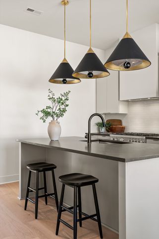 a living room with furniture potted plant and window