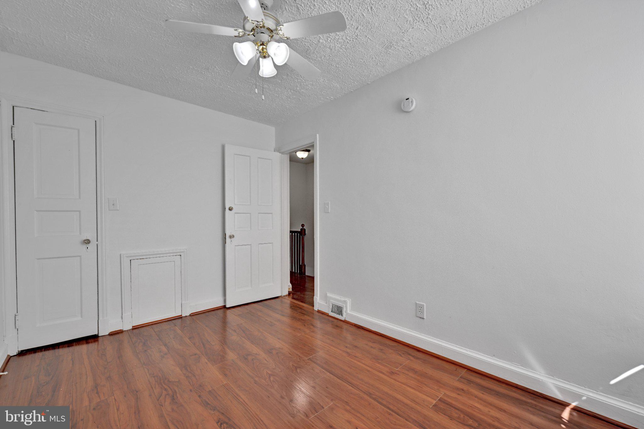 4607 North Capitol Street Northeast Washington, DC 20011 - Photo 12 of 25 wooden floor in an empty room with a window