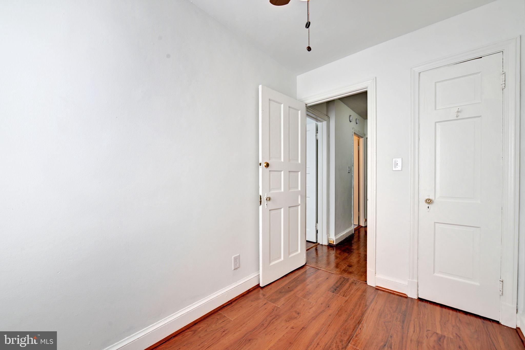 4607 North Capitol Street Northeast Washington, DC 20011 - Photo 13 of 25 an empty room with wooden floor