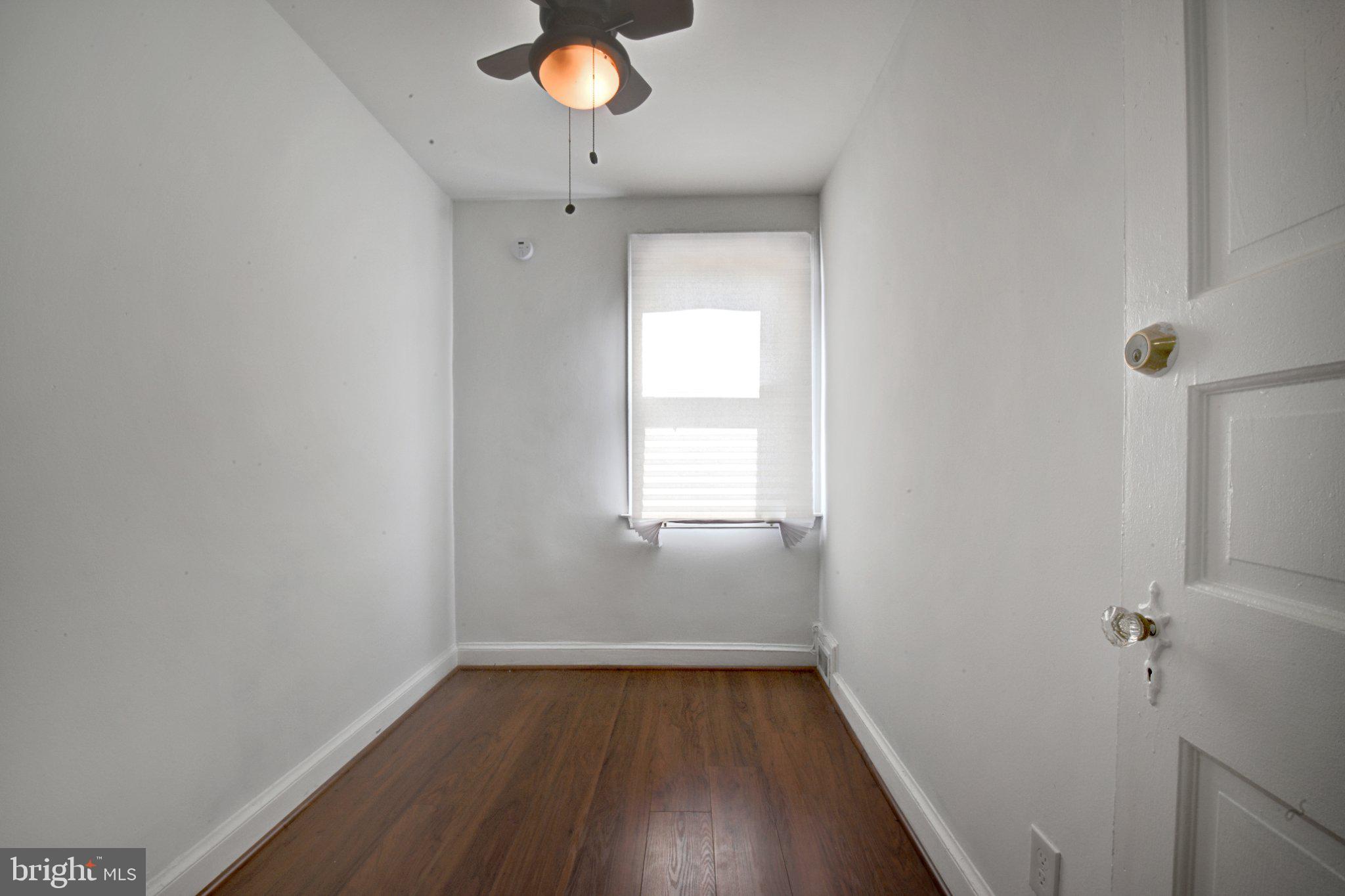 4607 North Capitol Street Northeast Washington, DC 20011 - Photo 15 of 25 a view of a room with wooden floor and fan
