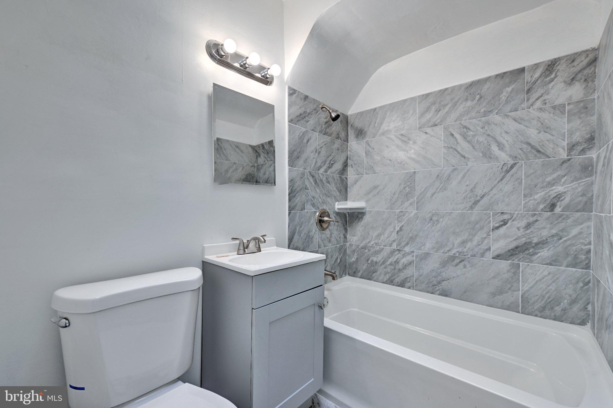 4607 North Capitol Street Northeast Washington, DC 20011 - Photo 16 of 25 a bathroom with a sink toilet and shower