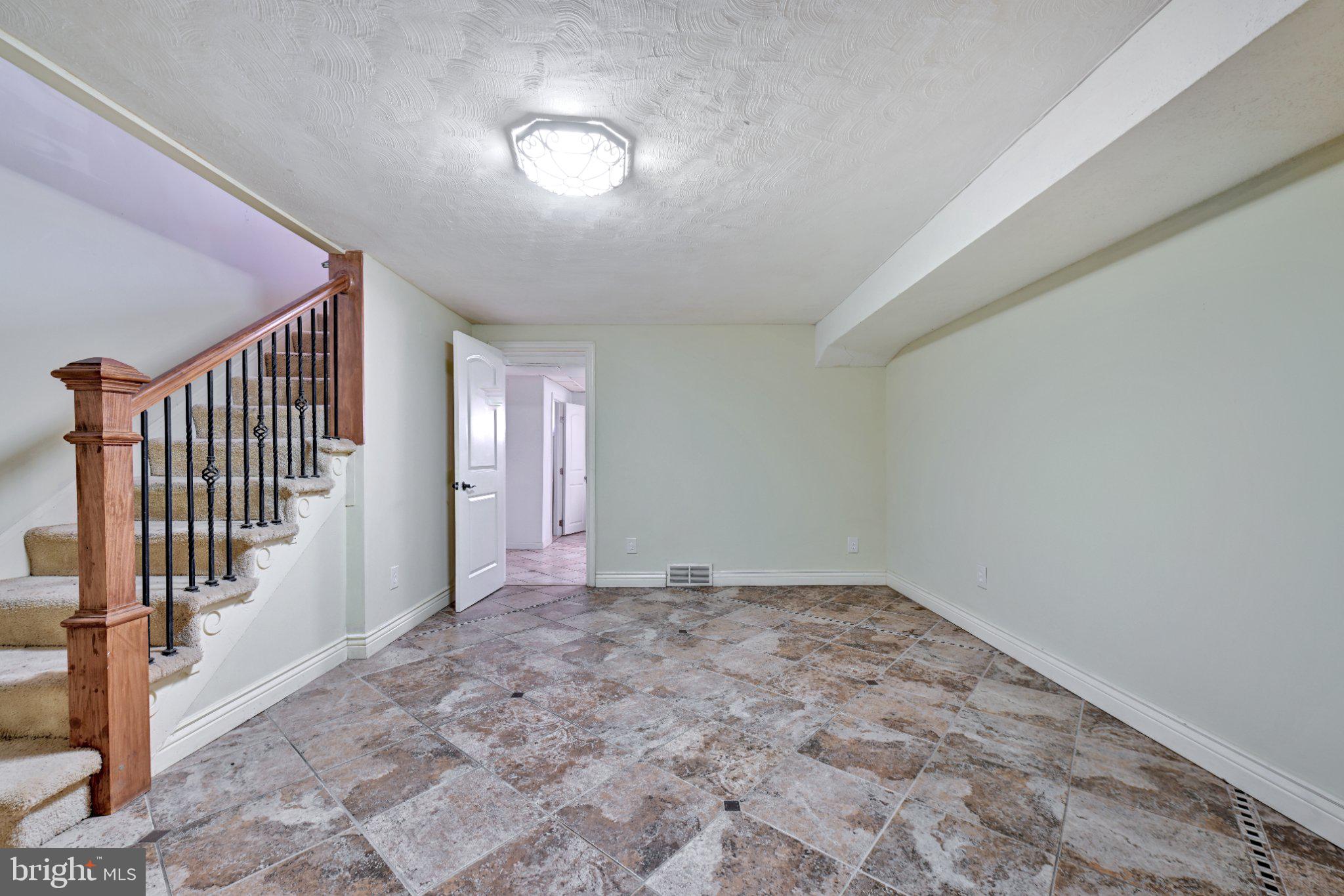 4607 North Capitol Street Northeast Washington, DC 20011 - Photo 18 of 25 a view of an empty room with stairs