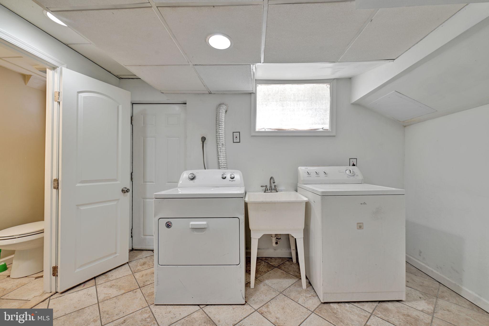 4607 North Capitol Street Northeast Washington, DC 20011 - Photo 21 of 25 a view of utility room with closet dryer and washer