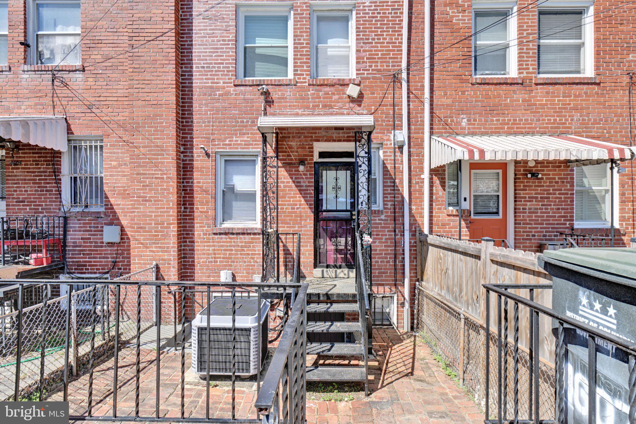 4607 North Capitol Street Northeast Washington, DC 20011 - Photo 24 of 25 front view of a brick building with a large window