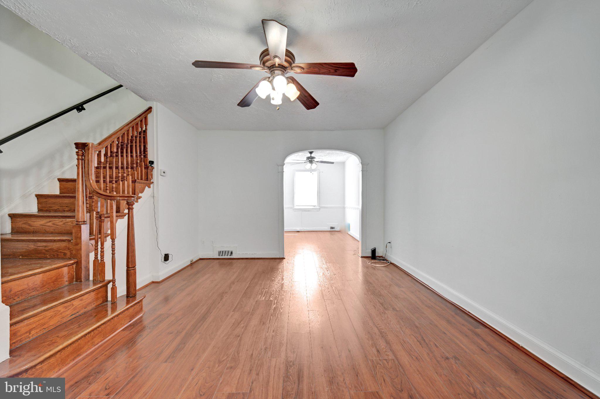 4607 North Capitol Street Northeast Washington, DC 20011 - Photo 4 of 25 wooden floor in an empty room with a window
