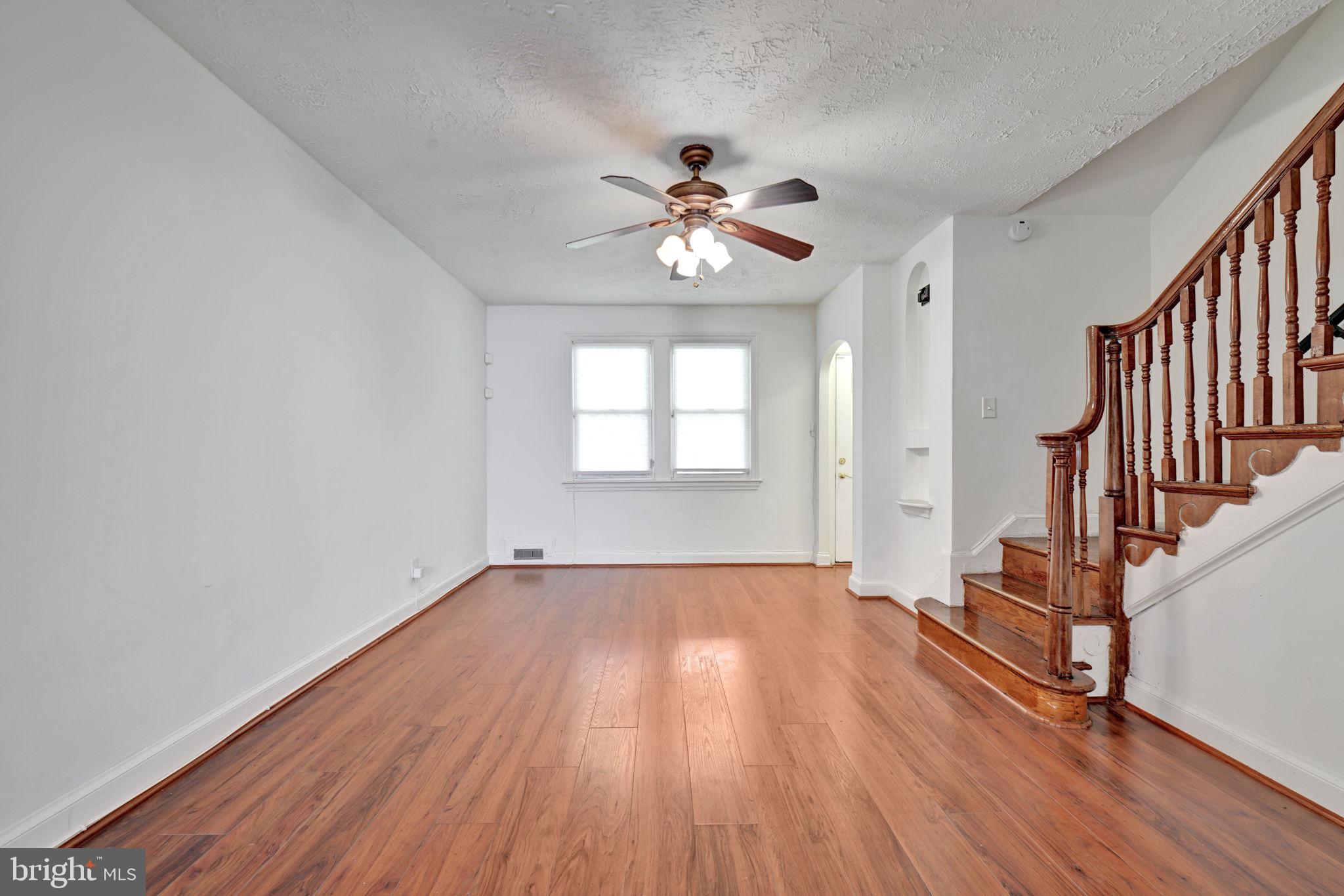4607 North Capitol Street Northeast Washington, DC 20011 - Photo 5 of 25 wooden floor in an empty room with a window
