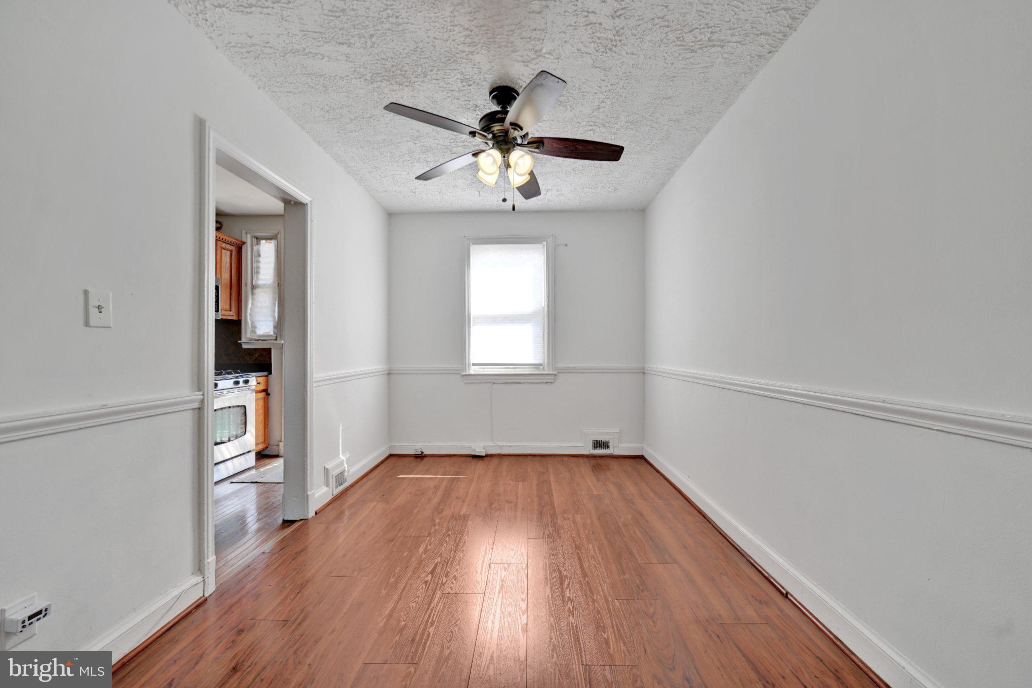4607 North Capitol Street Northeast Washington, DC 20011 - Photo 7 of 25 wooden floor in an empty room with a window