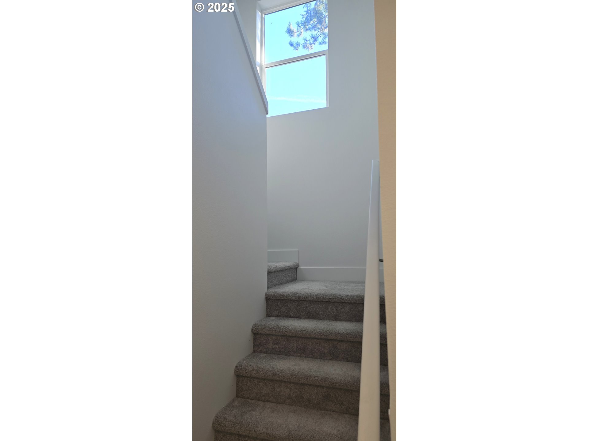 12451 Southeast Harold Street, Unit 1 Portland, OR 97236 - Photo 12 of 21 a view of staircase with white walls