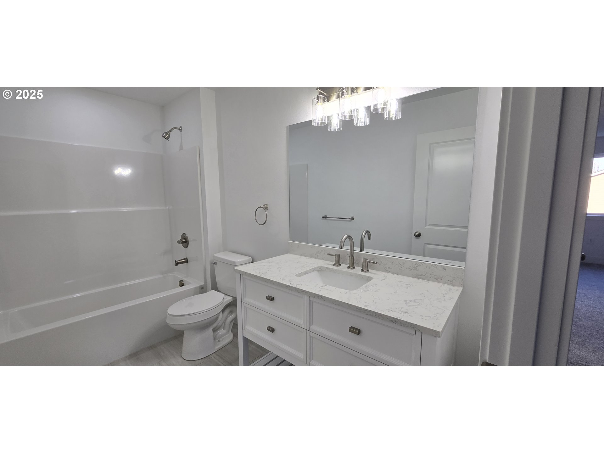 12451 Southeast Harold Street, Unit 1 Portland, OR 97236 - Photo 20 of 21 a bathroom with a sink a toilet and shower