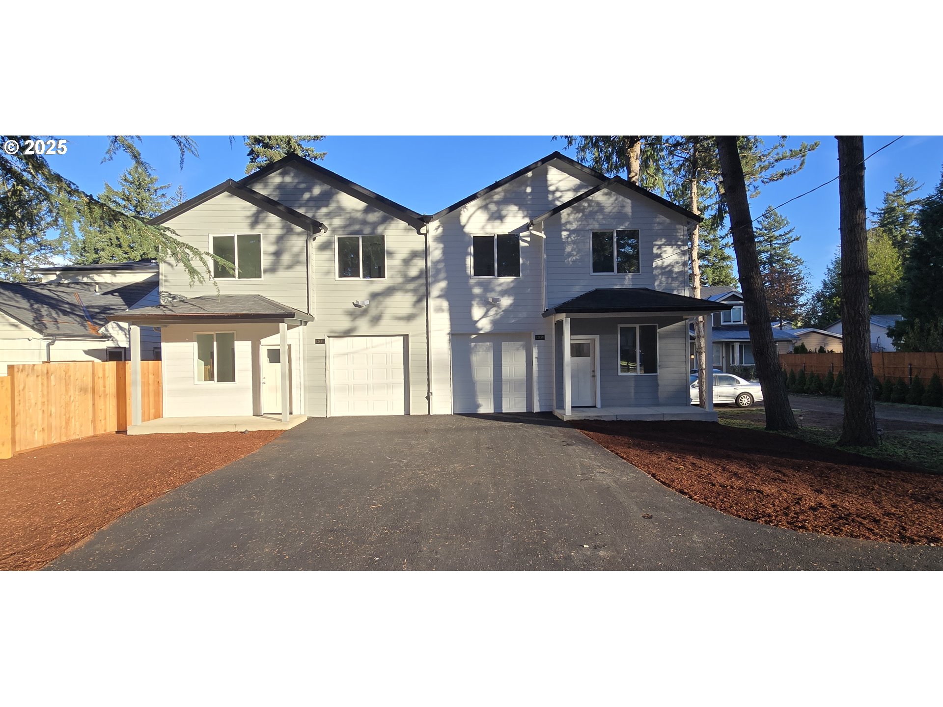 12451 Southeast Harold Street, Unit 1 Portland, OR 97236 - Photo 3 of 21 a house view with a garden space