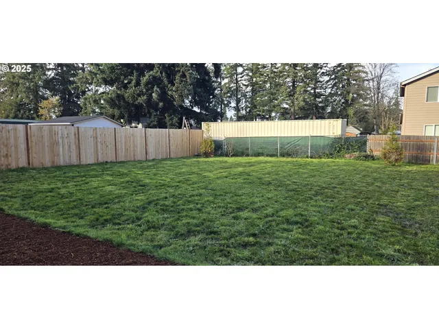 a view of backyard with green space