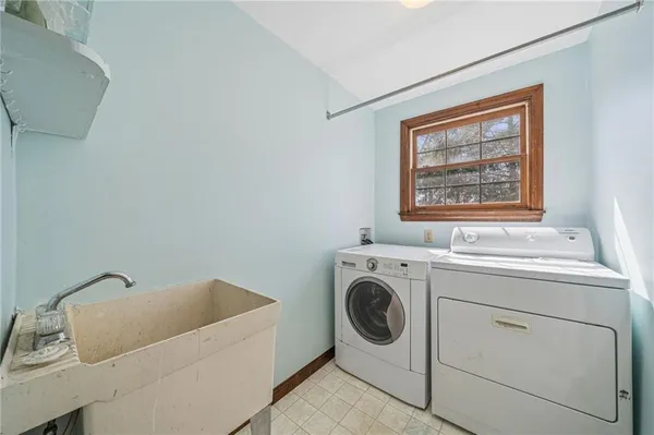 a utility room with dryer and washer