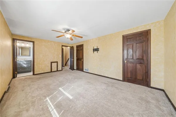 a view of a livingroom with a chandelier fan