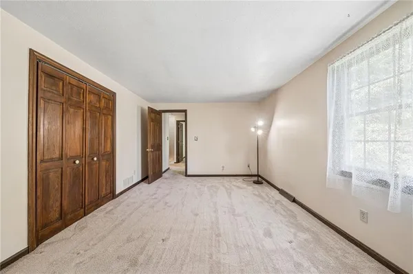 a view of an empty room and window