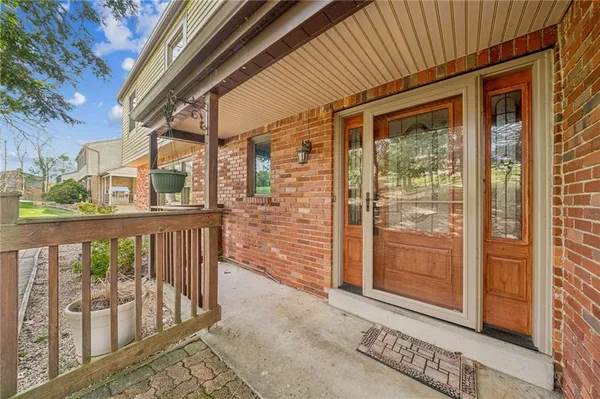 a view of a balcony with wooden floor