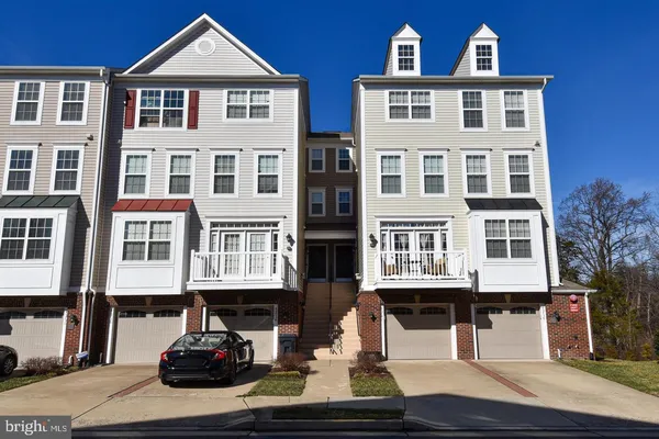 a front view of a building with many windows