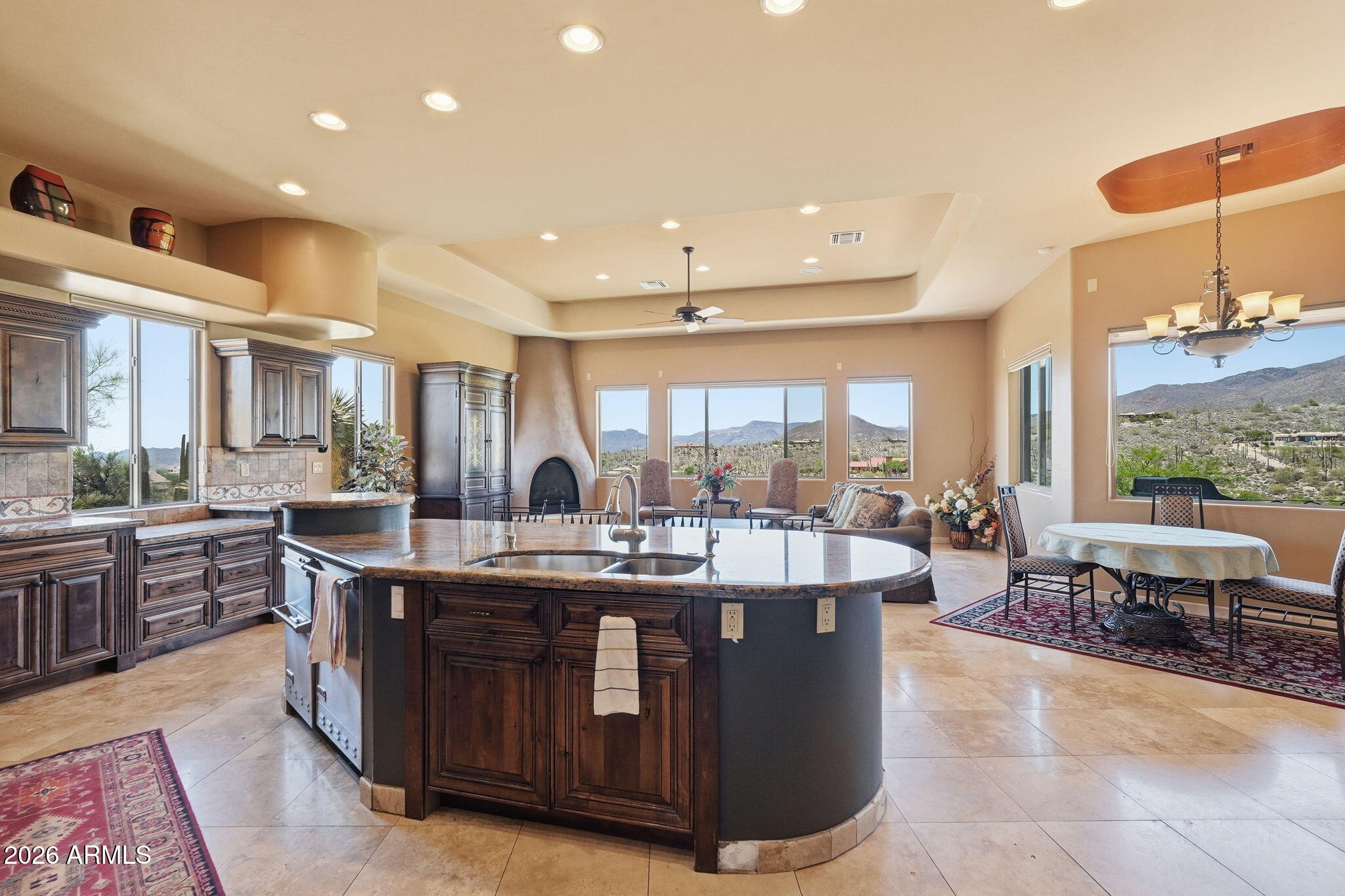 38211 North Sombrero Road Carefree, AZ 85377 - Photo 10 of 50 a large kitchen with kitchen island a sink a stove and a large window