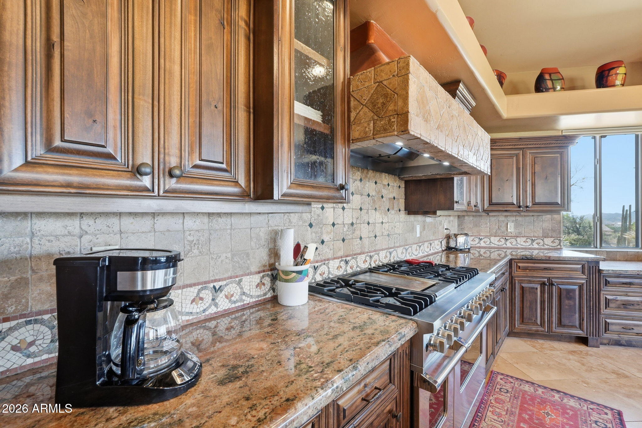38211 North Sombrero Road Carefree, AZ 85377 - Photo 11 of 50 a kitchen with a stove and a sink