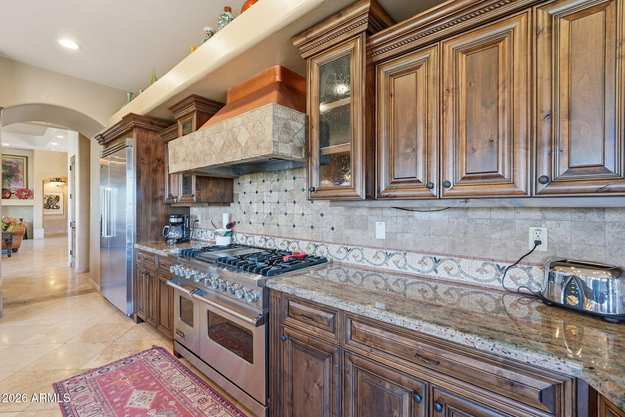 38211 North Sombrero Road Carefree, AZ 85377 - Photo 12 of 50 a kitchen with stainless steel appliances granite countertop a stove a sink and a granite counter tops