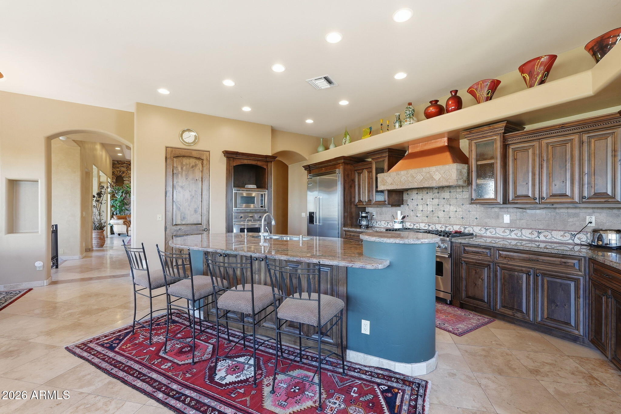 38211 North Sombrero Road Carefree, AZ 85377 - Photo 13 of 50 a kitchen with stainless steel appliances granite countertop a refrigerator and a stove top oven