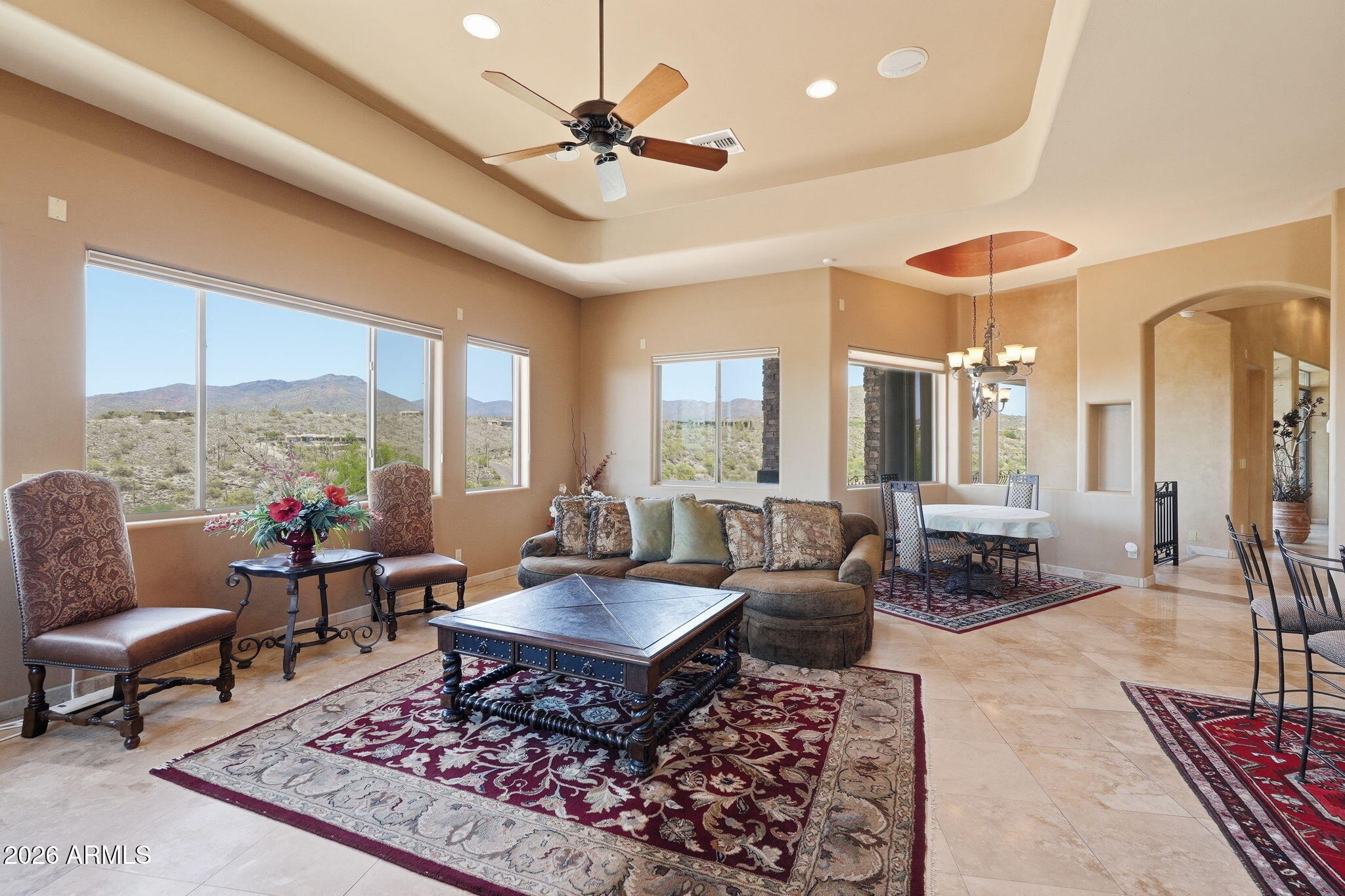 38211 North Sombrero Road Carefree, AZ 85377 - Photo 14 of 50 a living room with furniture a rug and a chandelier