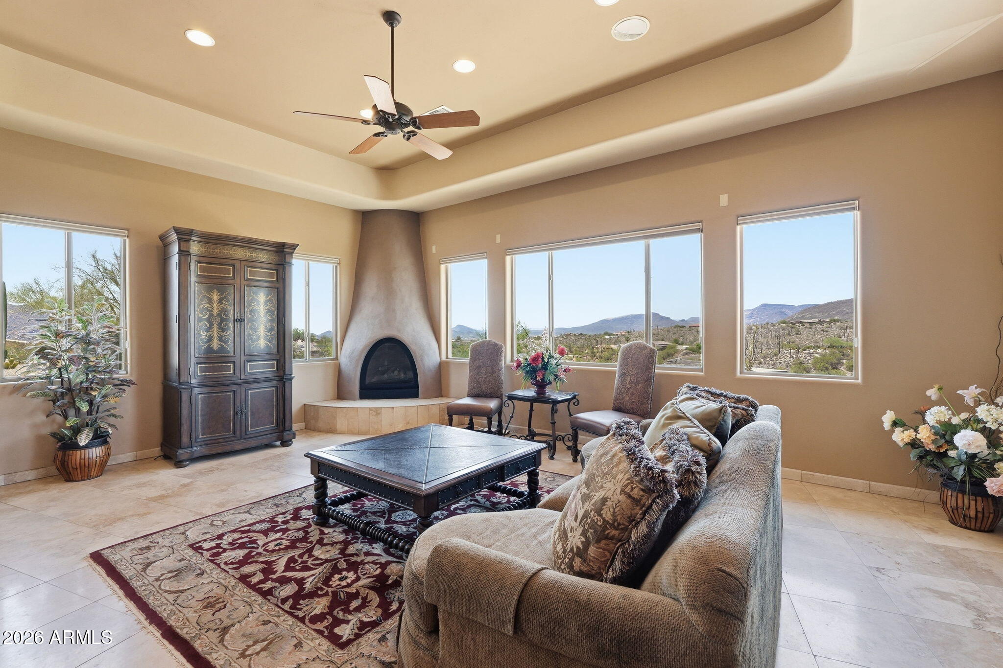 38211 North Sombrero Road Carefree, AZ 85377 - Photo 15 of 50 a living room with furniture a chandelier and a rug