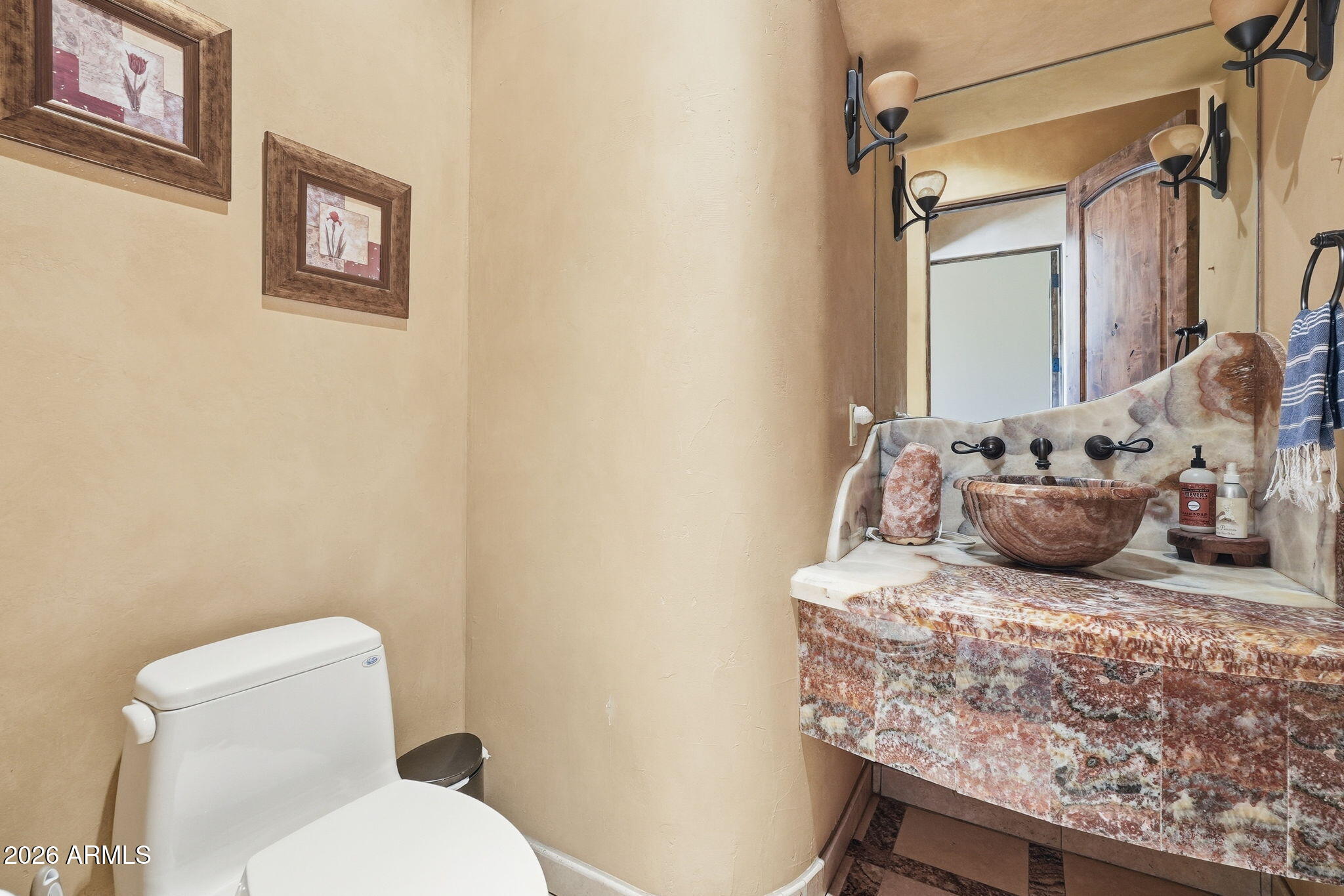 38211 North Sombrero Road Carefree, AZ 85377 - Photo 18 of 50 a bathroom with a granite countertop sink and a toilet