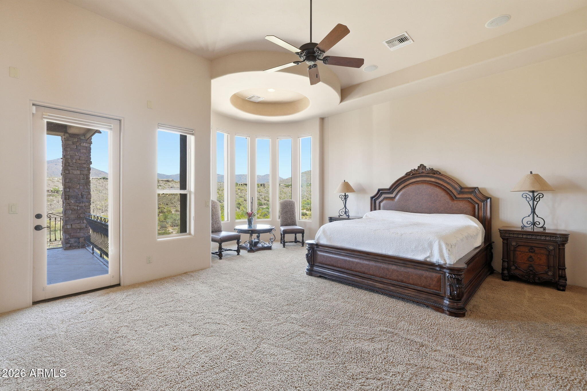 38211 North Sombrero Road Carefree, AZ 85377 - Photo 21 of 50 a spacious bedroom with a bed and a large window