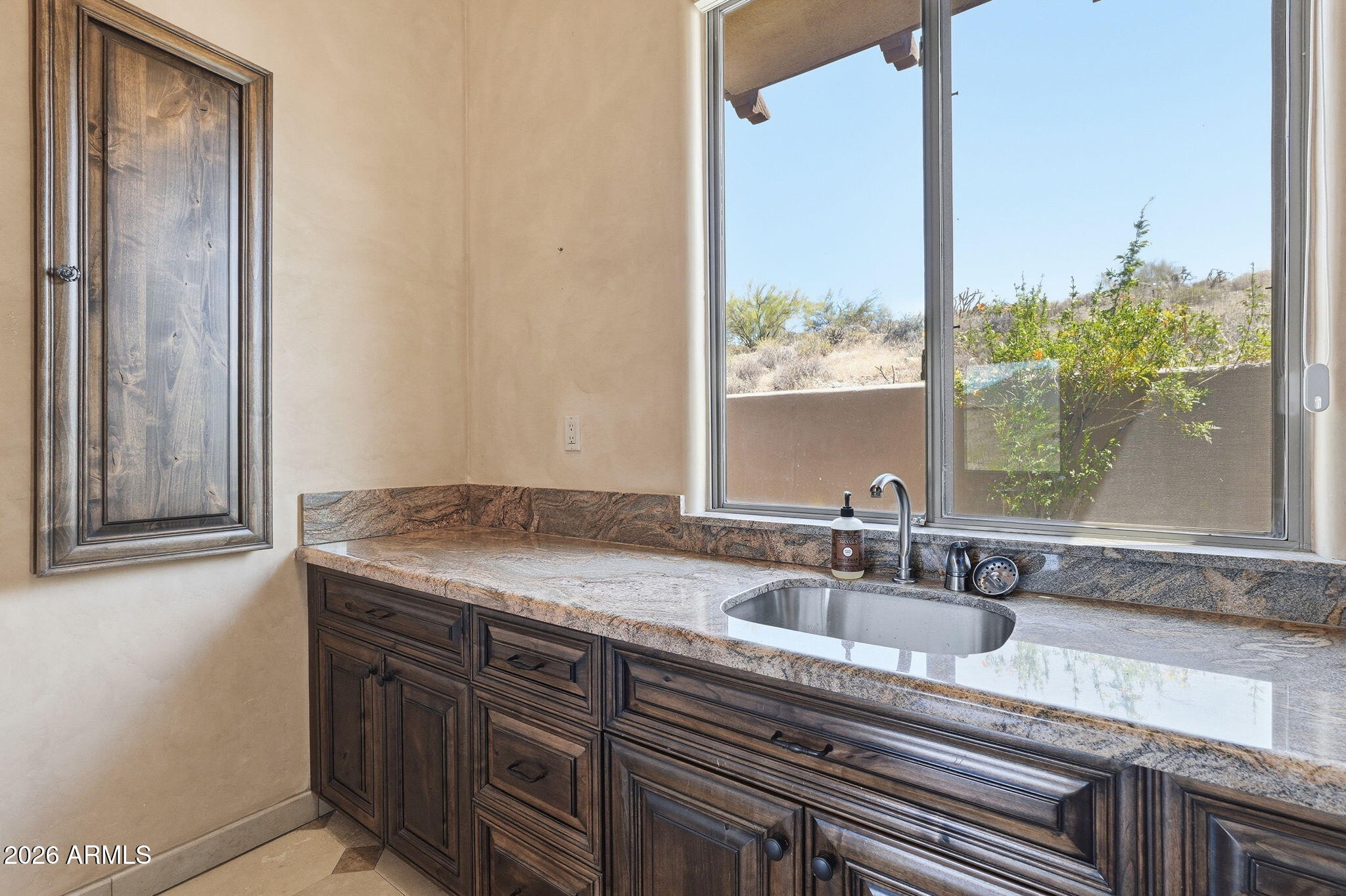 38211 North Sombrero Road Carefree, AZ 85377 - Photo 26 of 50 a sink with a granite countertop window and a sink