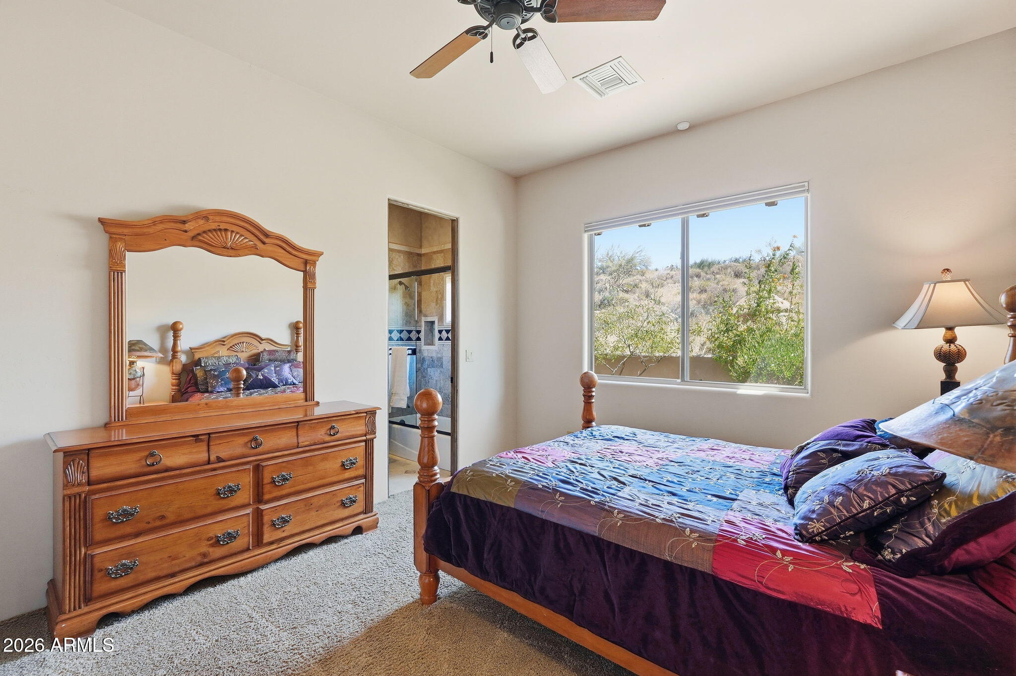 38211 North Sombrero Road Carefree, AZ 85377 - Photo 29 of 50 a bedroom with a bed and a window
