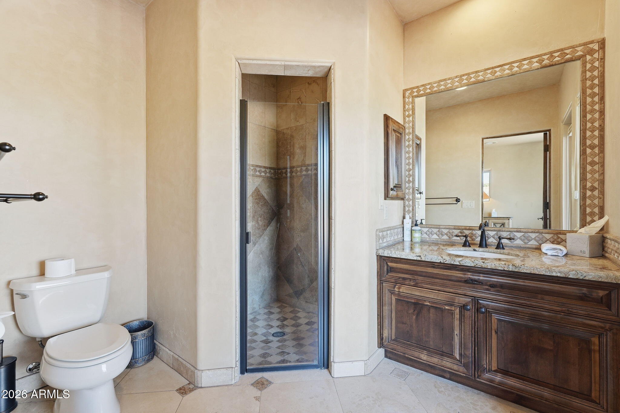 38211 North Sombrero Road Carefree, AZ 85377 - Photo 30 of 50 a bathroom with a toilet sink and mirror