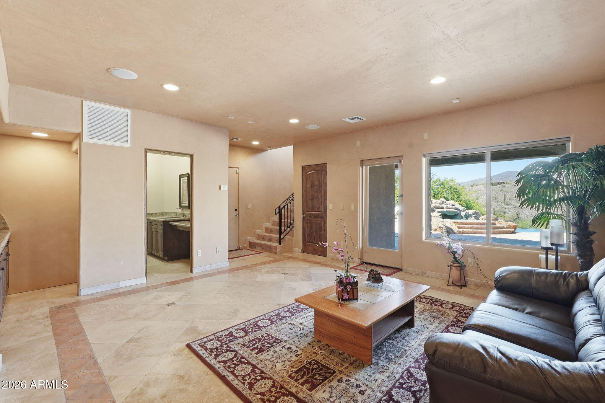 38211 North Sombrero Road Carefree, AZ 85377 - Photo 33 of 50 a living room with furniture and a large window