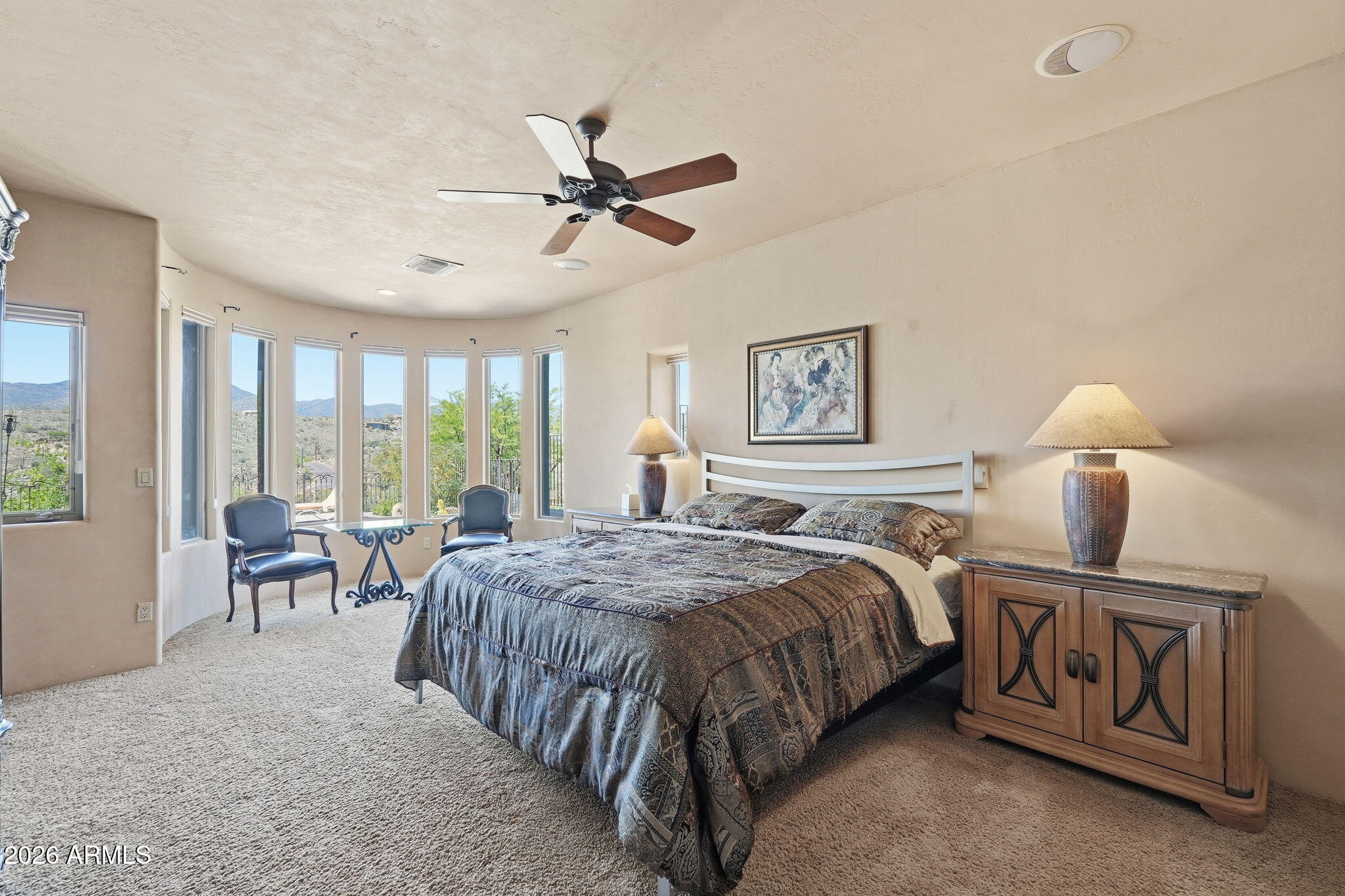 38211 North Sombrero Road Carefree, AZ 85377 - Photo 34 of 50 a bed room with a bed and large windows