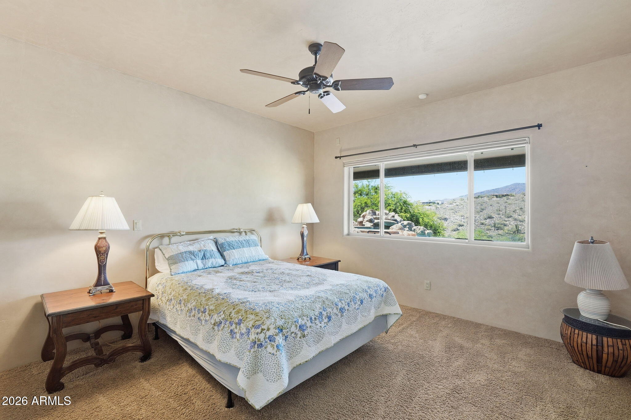 38211 North Sombrero Road Carefree, AZ 85377 - Photo 35 of 50 a bedroom with a bed and a window