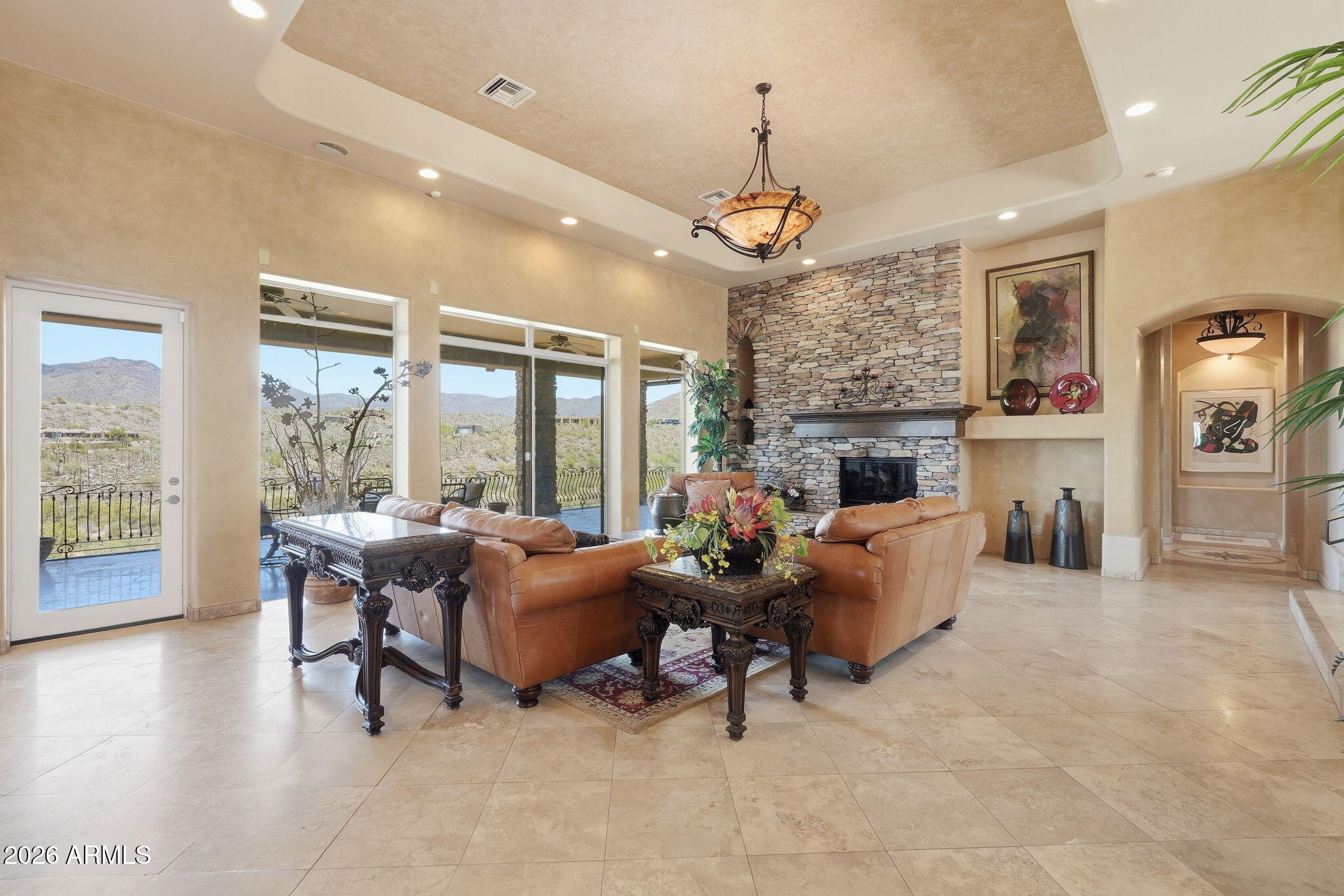 38211 North Sombrero Road Carefree, AZ 85377 - Photo 4 of 50 a living room with fireplace furniture and a large window