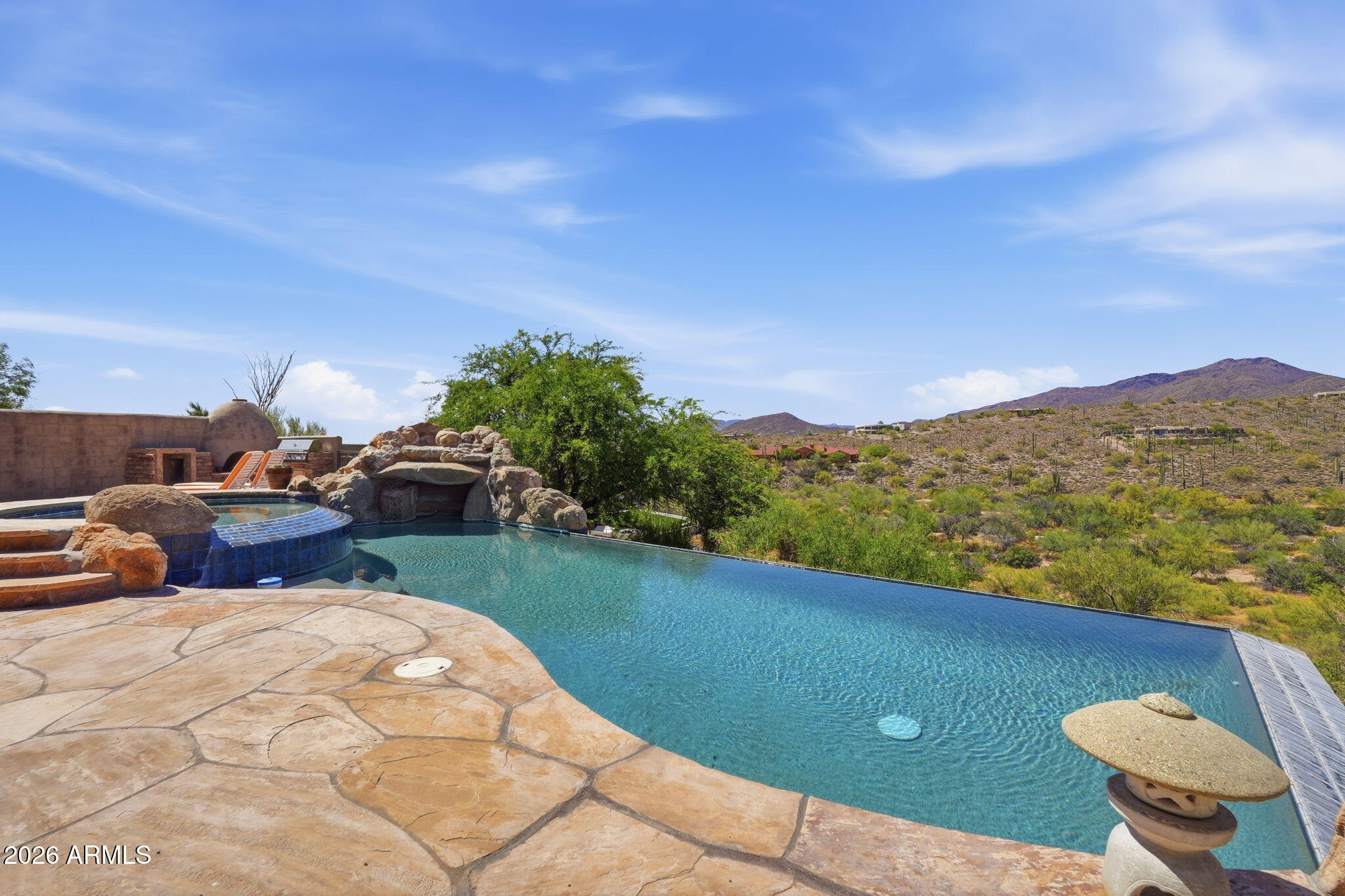 38211 North Sombrero Road Carefree, AZ 85377 - Photo 40 of 50 a view of a backyard with table and chairs