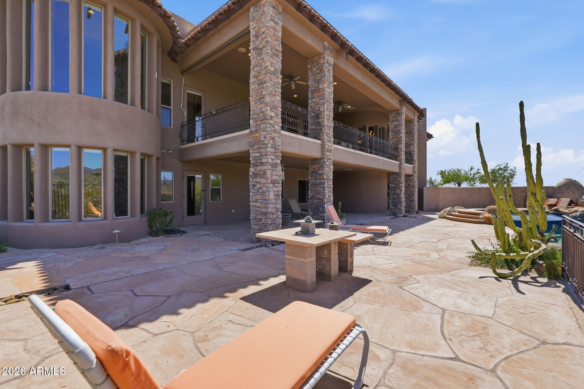 38211 North Sombrero Road Carefree, AZ 85377 - Photo 43 of 50 a view of a patio with couches table and chairs and potted plants