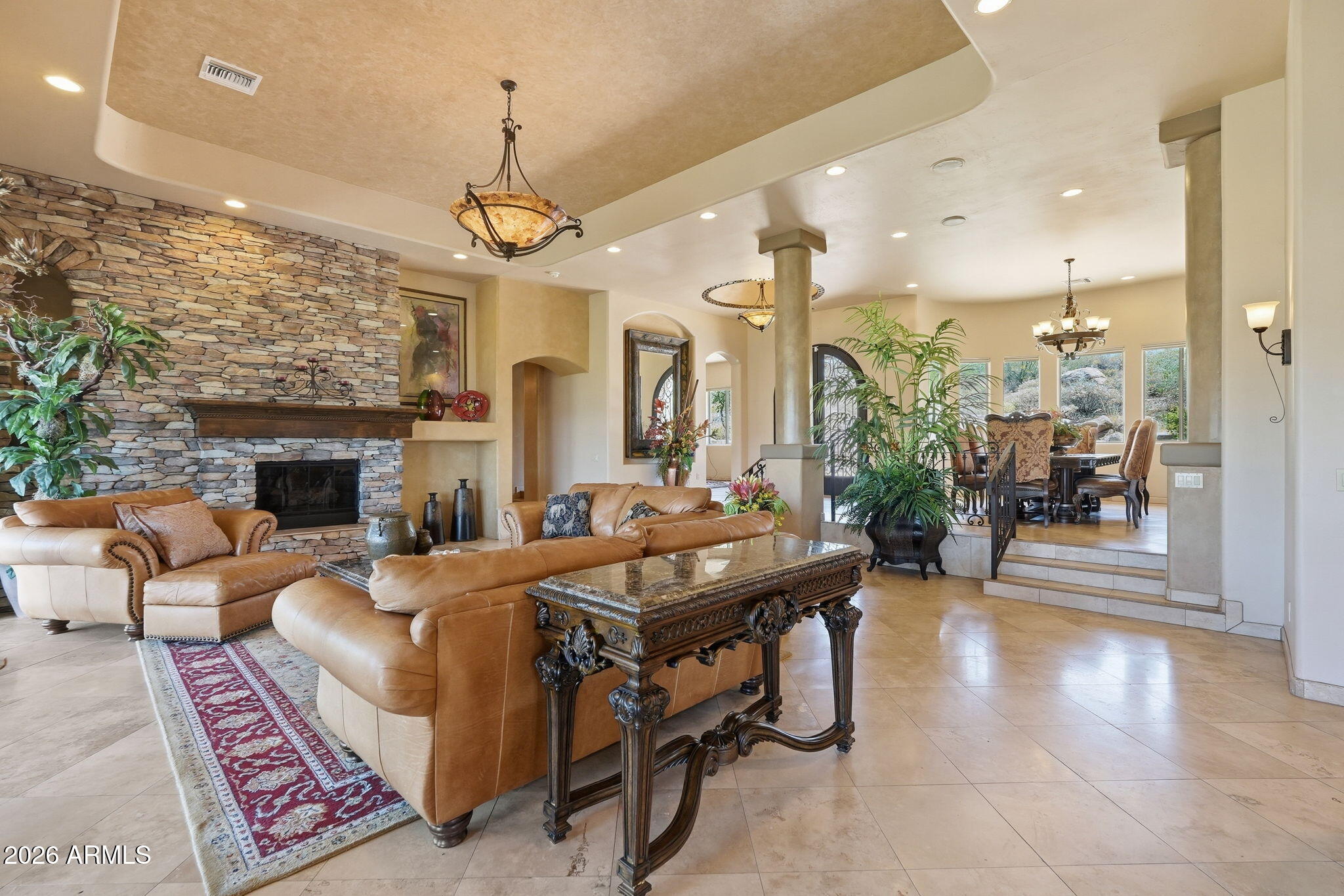 38211 North Sombrero Road Carefree, AZ 85377 - Photo 50 of 50 a living room with fireplace furniture and a chandelier